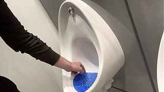faggot cleans the urinal